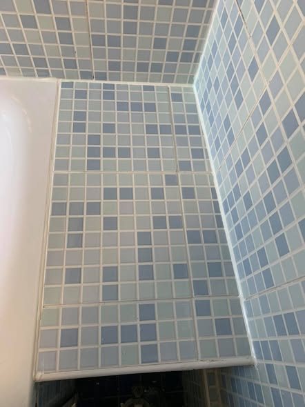 Bath side panel refitted neatly against the wall